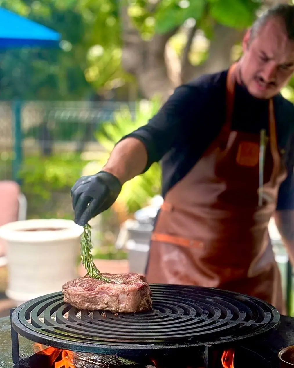 Our chef at the fire-pit grill